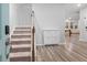 Bright entryway with carpeted stairs and view to living area at 530 Richfield Way, Summerville, SC 29486