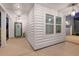White front porch with teal door, white columns, and pendant lighting at 530 Richfield Way, Summerville, SC 29486
