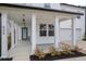 White front porch with teal door and white columns at 530 Richfield Way, Summerville, SC 29486