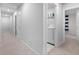 Hallway with carpet, doors to bedrooms, and laundry room access at 530 Richfield Way, Summerville, SC 29486