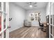 Home office with hardwood floors, built-in shelving, and large windows at 530 Richfield Way, Summerville, SC 29486