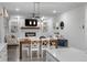 Open concept kitchen and dining area with white cabinets and a farmhouse table at 530 Richfield Way, Summerville, SC 29486