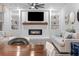 Open living room with a fireplace, built-in shelving and comfortable seating at 530 Richfield Way, Summerville, SC 29486
