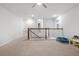 Spacious loft area with carpeted floors and a view of the lower level at 530 Richfield Way, Summerville, SC 29486