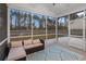 Relaxing screened porch with comfortable seating and backyard view at 530 Richfield Way, Summerville, SC 29486