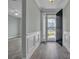 Bright entryway with white wainscoting and hardwood floors at 546 Four Seasons Blvd, Summerville, SC 29486