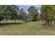 Yard with large trees and a partially sunny day at 669 Heyward Ln, Moncks Corner, SC 29461