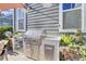 Outdoor kitchen with stainless steel appliances and granite countertops at 703 N Hickory St, Summerville, SC 29483