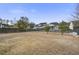 Large fenced backyard with open grassy area at 705 Quintan St, Summerville, SC 29486