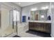 Elegant bathroom with double vanity, soaking tub, and walk-in shower at 705 Quintan St, Summerville, SC 29486