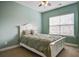 Bedroom with white bed frame and green bedding at 705 Quintan St, Summerville, SC 29486