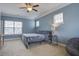 Primary bedroom with blue walls and ceiling fan at 705 Quintan St, Summerville, SC 29486