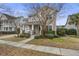 Two-story house with gray siding, white columns, landscaping, and a tree at 705 Quintan St, Summerville, SC 29486