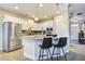 Modern kitchen with white cabinets, granite counters, and stainless steel appliances at 705 Quintan St, Summerville, SC 29486