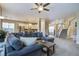 Open living room with sectional sofa, kitchen view, and stairs at 705 Quintan St, Summerville, SC 29486