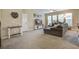 Spacious living room with sectional sofa, large TV, and carpeted floors at 705 Quintan St, Summerville, SC 29486
