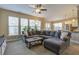 Spacious living room featuring a sectional sofa and large windows at 705 Quintan St, Summerville, SC 29486