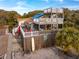 Two-story beach house with multiple decks and surfboards at 904 E Arctic Ave, Folly Beach, SC 29439