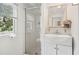 Small bathroom with shower, vanity, and window at 904 E Arctic Ave, Folly Beach, SC 29439