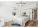 Bright bedroom with a comfortable bed and hardwood floors at 904 E Arctic Ave, Folly Beach, SC 29439