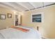 Bright bedroom with wood floors and coastal art at 904 E Arctic Ave, Folly Beach, SC 29439