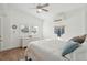 Bright bedroom with a queen-size bed and hardwood floors at 904 E Arctic Ave, Folly Beach, SC 29439