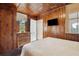 Bedroom with wood paneled walls and a TV at 904 E Arctic Ave, Folly Beach, SC 29439