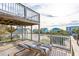 Relaxing deck with wooden chairs, offering scenic neighborhood views at 904 E Arctic Ave, Folly Beach, SC 29439