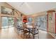 Bright dining room with a large table and access to a deck at 904 E Arctic Ave, Folly Beach, SC 29439
