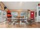 Spacious dining room with a large wooden table and metal chairs at 904 E Arctic Ave, Folly Beach, SC 29439