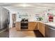 Modern kitchen with stainless steel appliances and wood flooring at 904 E Arctic Ave, Folly Beach, SC 29439