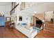 Living room features a comfy couch and a rustic wooden staircase at 904 E Arctic Ave, Folly Beach, SC 29439
