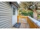 Private side deck with exterior access and tree views at 904 E Arctic Ave, Folly Beach, SC 29439