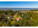 Waterfront property with white house and red roof at 927 Fishburne Rd, Pinopolis, SC 29469