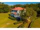 White house with red roof and large green lawn at 927 Fishburne Rd, Pinopolis, SC 29469