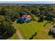 White house with red roof and expansive green lawn at 927 Fishburne Rd, Pinopolis, SC 29469