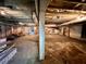 Unfinished basement with dirt floor and exposed support beams at 927 Fishburne Rd, Pinopolis, SC 29469