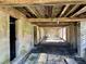 Unfinished basement with exposed beams and dirt floor at 927 Fishburne Rd, Pinopolis, SC 29469