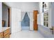 Small bathroom with a blue bathtub and wood cabinets at 927 Fishburne Rd, Pinopolis, SC 29469