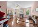 Bedroom with hardwood floors, fireplace, and a piano at 927 Fishburne Rd, Pinopolis, SC 29469