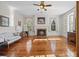 Bedroom with hardwood floors, fireplace, and plenty of natural light at 927 Fishburne Rd, Pinopolis, SC 29469