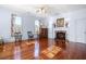 Bedroom with hardwood floors, fireplace, and rocking chairs at 927 Fishburne Rd, Pinopolis, SC 29469