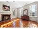 Bedroom with hardwood floors, fireplace, and large windows at 927 Fishburne Rd, Pinopolis, SC 29469