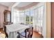 Charming breakfast nook with a table and chairs, large windows and view at 927 Fishburne Rd, Pinopolis, SC 29469