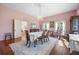 Bright dining room with hardwood floors, chandelier, and large windows at 927 Fishburne Rd, Pinopolis, SC 29469