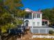 Two-story white house with red roof, porch, and brick steps at 927 Fishburne Rd, Pinopolis, SC 29469