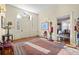 Bright foyer with hardwood floors, ornate rug and nutcrackers at 927 Fishburne Rd, Pinopolis, SC 29469