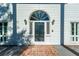 Elegant arched front door with glass and brick inlay at 927 Fishburne Rd, Pinopolis, SC 29469