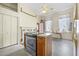 Kitchen with island, wood cabinets, and a brick fireplace at 927 Fishburne Rd, Pinopolis, SC 29469