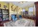 Library with fireplace, built-in shelves, and comfy armchairs at 927 Fishburne Rd, Pinopolis, SC 29469